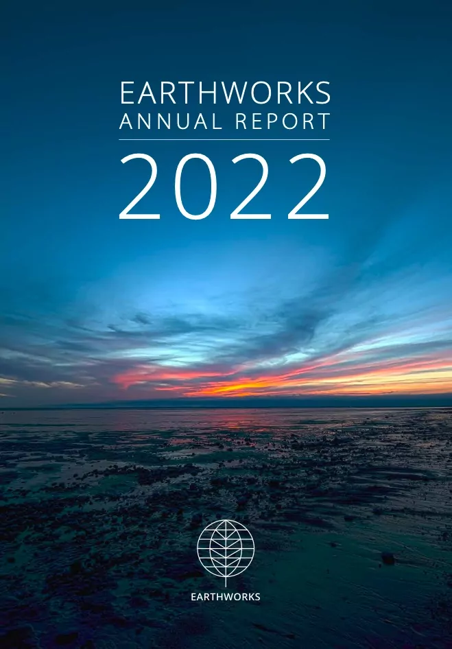 Cover image of Earthworks 2022 Annual Report shows a blue sky over a shoreline at sunrise.