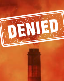 A photo of a power plant smokestack emitting fumes with the word DENIED written over it in all capital letters. 