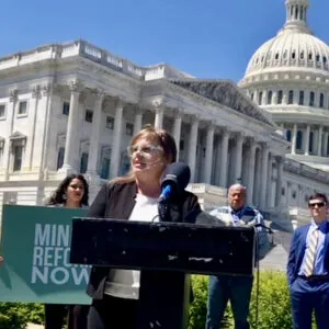 Lauren Pagel speaking in front of the Capitol Building