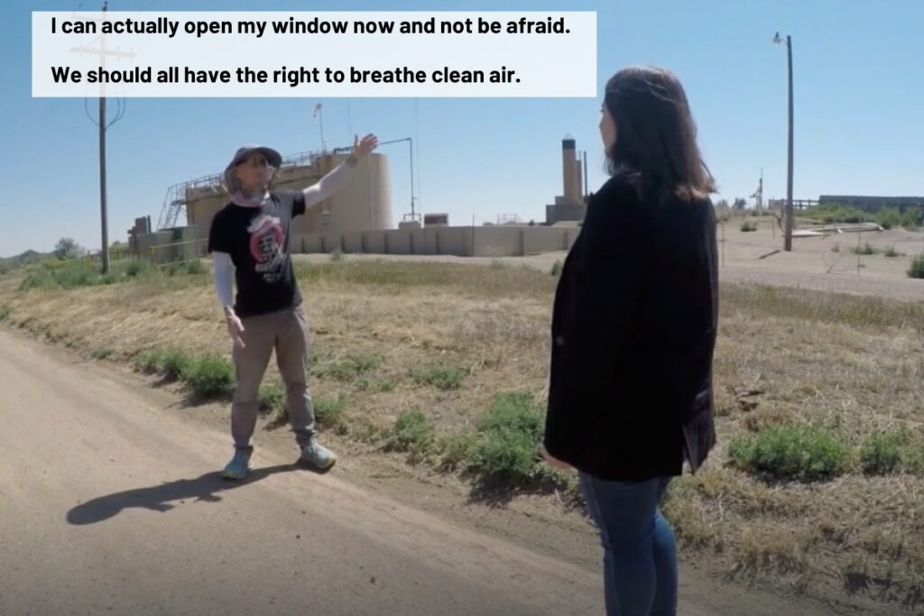 Von Bortz talks to a reporter in front of Prospect Energy storage tanks. A quote over the image says "I can actually open my window now and not be afraid. We should all have the right to breathe clean air." 