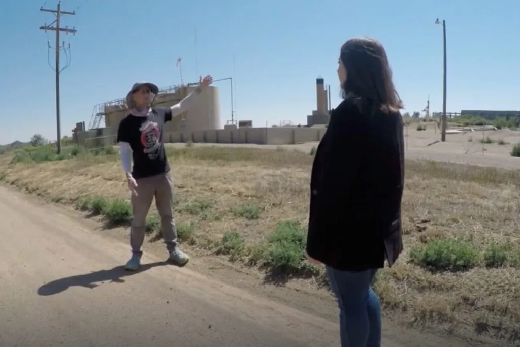 Von Bortz talks to a reporter in front of Prospect Energy storage tanks.