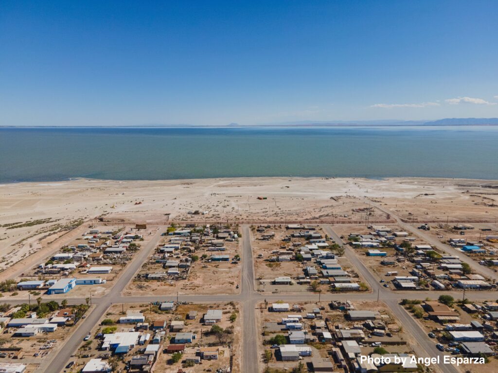 aerial view of homes on the shore of a lake in a desert setting